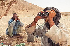 Tuareg Men Using Binoculars in the Sahara by M1key.me binoculars photo